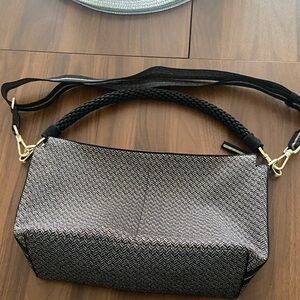 Rothy's Elegant Black and Gold Shoulder Bag